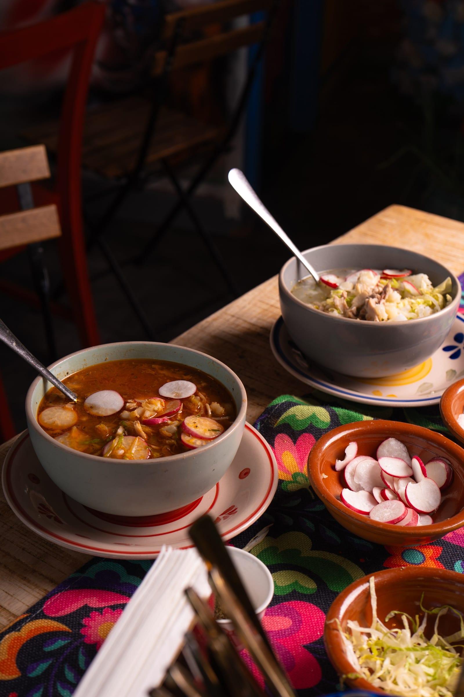 Querida Magazine — Mama's Best · Pozole rojo y blanco, page 3 of 10. Ten plates from Mama's kitchen — the new pozole, the family table, the room when it fills. Destination: Querida — Al Barsha 1, Dubai.