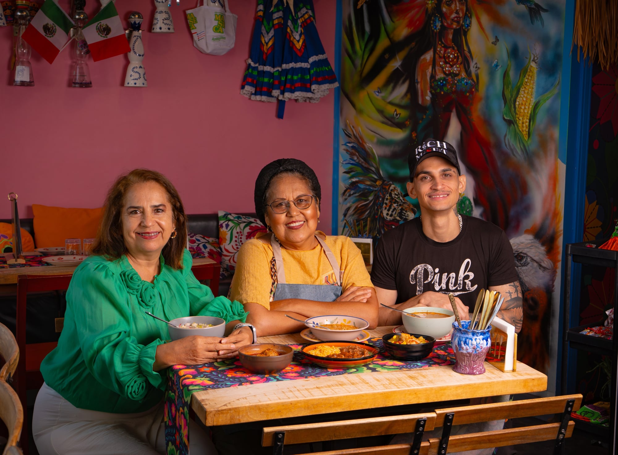 Three at the family table — sharing the menu, the way Querida is meant to be eaten